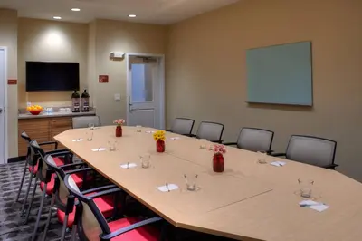 a conference room with a large table and chairs at TownePlace Suites by Marriott Cleveland Solon in Solon