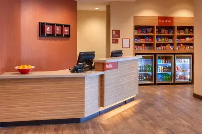 a lobby of a pharmacy with a counter and a pharmacyacistacistacistacistacist at TownePlace Suites by Marriott Cleveland Solon in Solon