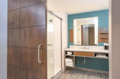 a bathroom with a sink and a mirror at Hilton Garden Inn Cincinnati Midtown in Cincinnati