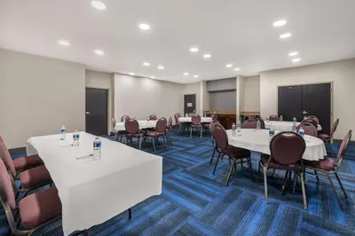 a conference room with white tables and chairs at Best Western Plus Richmond Indiana I-70 in Richmond