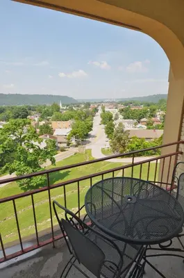 a balcony with a table and chairs and a view at Hillside Inn in Madison