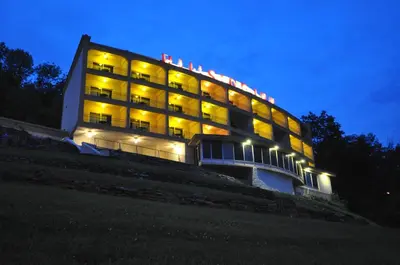 a building lit up at night with lights at Hillside Inn in Madison