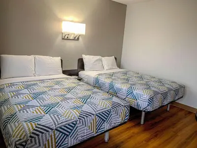 a hotel room with two beds in a room at Motel 6-Dayton, OH in Dayton