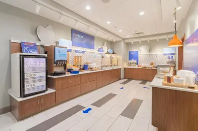 an apple store with wooden counters and an apple store at Holiday Inn Express & Suites - Marion by IHG in Marion