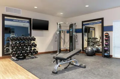 a fitness room with a gym with weights at Hampton Inn & Suites Xenia Dayton in Xenia