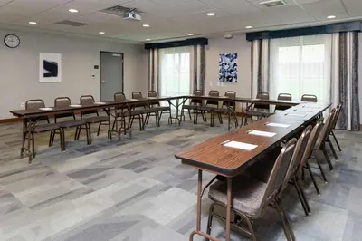 a conference room with long tables and chairs at Hampton Inn & Suites Xenia Dayton in Xenia