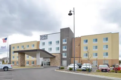 a building with cars parked in a parking lot at Fairfield Inn & Suites by Marriott Columbus Grove City in Grove City