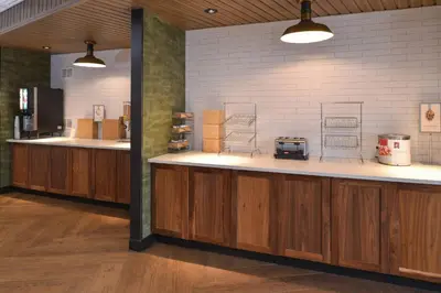 a kitchen with wooden counters and a counter top at Fairfield Inn & Suites by Marriott Columbus Grove City in Grove City