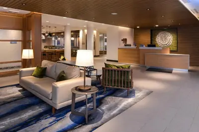 a lobby of a hotel with a couch and chairs at Fairfield Inn & Suites by Marriott Columbus Grove City in Grove City