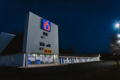 a building with a walmart sign on it at night at Motel 6 Bellville, OH in Bellville