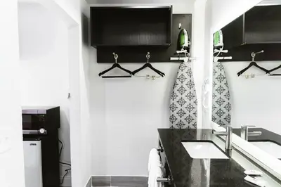 a bathroom with a black counter and a sink at Motel 6 Bellville, OH in Bellville