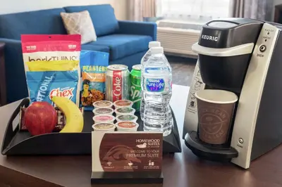 a box of breakfast food and a coffee maker on a table at Homewood Suites Fort Wayne in Fort Wayne