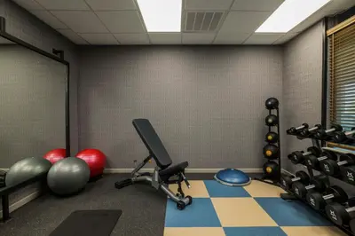 a room with a gym with exercise equipment at Four Points by Sheraton Columbus-Polaris in Columbus