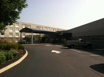 a truck parked in a parking lot next to a building at Hope Hotel and Richard C. Holbrooke Conference Center in Fairborn