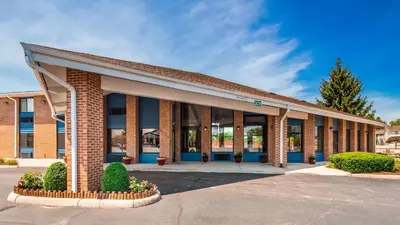 a brick school building with a lot of windows at Best Western Muncie in Muncie