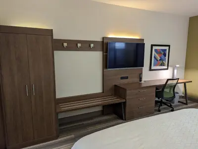 a hotel room with a desk and a flat screen tv at Holiday Inn Express - Lexington East - Winchester by IHG in Winchester