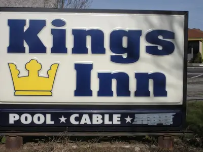 a sign for a kukes pool centre at Kings Inn Cleveland in Strongsville