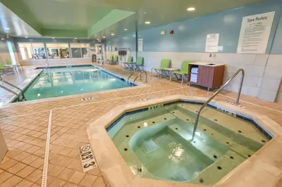 a large swimming pool in a hotel room at Holiday Inn Express Hotel & Suites Richwood - Cincinnati South by IHG in Richwood