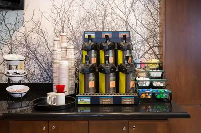 a group of bottles of wine sitting on a counter at Staybridge Suites Toledo/Maumee by IHG in Maumee