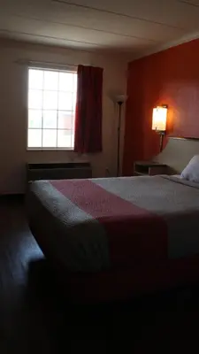 a hotel room with a bed and a window at Motel 6-Dayton, OH in Dayton