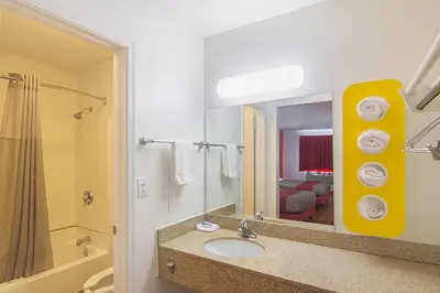 a bathroom with a sink and a mirror at Motel 6-Dayton, OH in Dayton