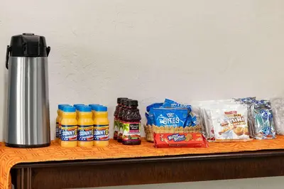 a counter with some food and drinks on it at Dover Inn and Suites in Dover