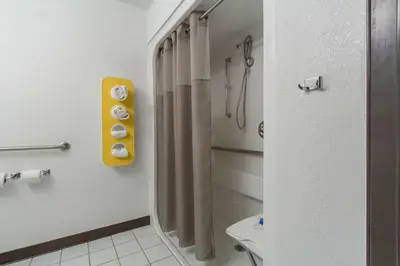 a bathroom with a shower curtain and a toilet at Motel 6-Streetsboro, OH in Streetsboro