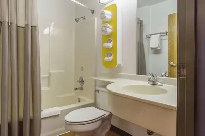 a white bathroom with a toilet and a sink at Motel 6-Streetsboro, OH in Streetsboro
