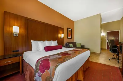 a bedroom with a large bed in a hotel room at Best Western Plus Georgetown Corporate Center Hotel in Georgetown