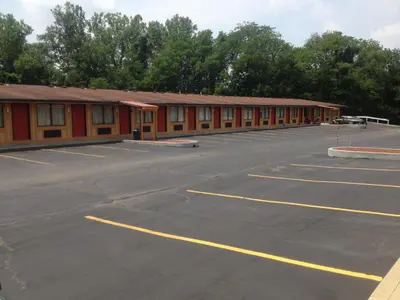 an empty parking lot in front of a building at Guest Inn Lebanon (Ohio) in Lebanon
