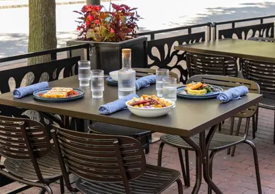 a wooden table with plates of food on it at Crowne Plaza Cleveland at Playhouse Square by IHG in Cleveland