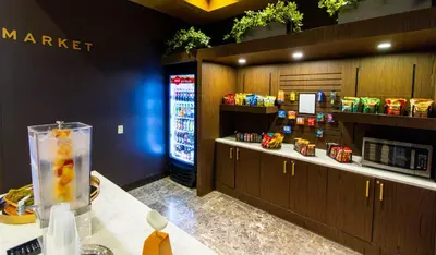 a store with a counter with a drink in a container at Crowne Plaza Cleveland at Playhouse Square by IHG in Cleveland