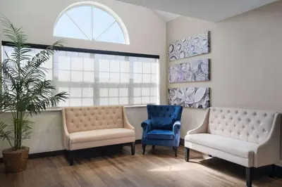 a waiting room with two chairs and a window at Baymont by Wyndham Boardman in Boardman
