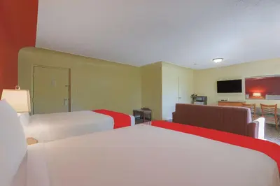 a hotel room with two beds and a flat screen tv at OYO Hotel North Lima OH - Boardman in North Lima