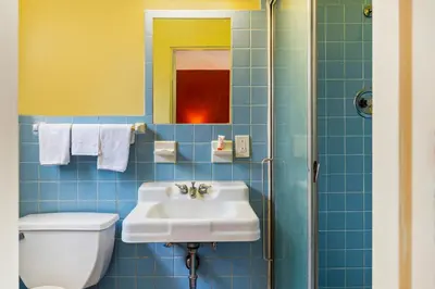 a bathroom with a sink and a toilet at OYO Hotel North Lima OH - Boardman in North Lima