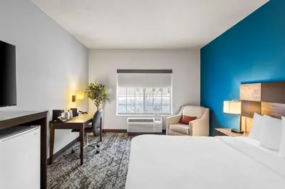 a hotel room with a bed and a desk at Best Western Fort Wayne Inn & Suites North in Fort Wayne