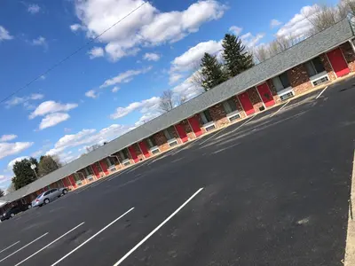 a view of a road with a building at Harcourt Motel in Mount Vernon