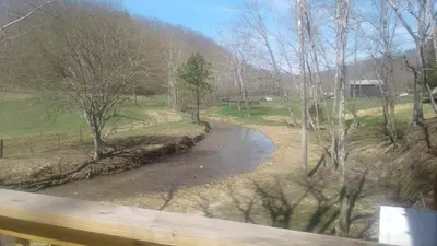 a view of a river from a bridge at Tranquil Waters Cabin in Frenchburg