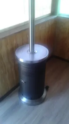a stove in a room with a window at Tranquil Waters Cabin in Frenchburg