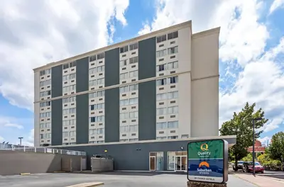 a large building with a sign in front of it at Quality Inn & Suites Charleston - Civic Center in Charleston