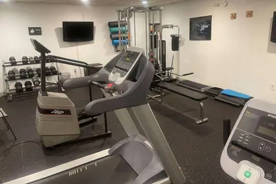a room with a gym with a treadmill at Days Inn by Wyndham Englewood Dayton Airport in Dayton