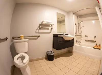 a bathroom with a toilet and a sink at Anderson Inn, Anderson, Indiana in Anderson