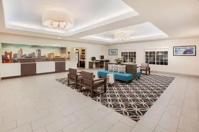a lobby of a hospital with a waiting room at La Quinta by Wyndham Cincinnati Airport Florence in Florence