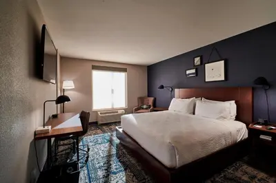a hotel room with a bed and a window at Four Points by Sheraton Cleveland-Eastlake in Eastlake