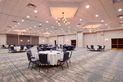 a banquet hall with tables and chairs in a room at Four Points by Sheraton Cleveland-Eastlake in Eastlake