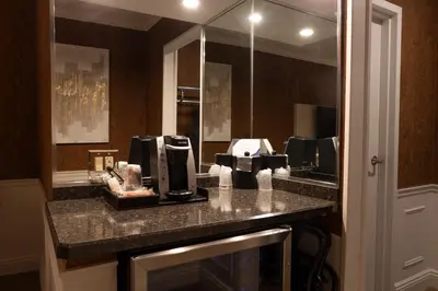 a bathroom with a counter with a coffee maker on it at The Grand Resort in Howland Corners