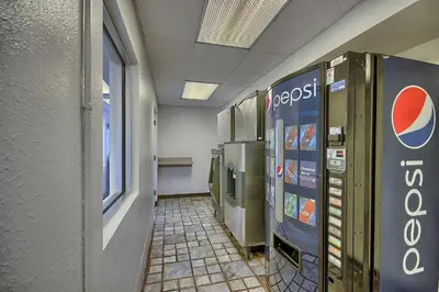 a hallway with a pepsi machine in a building at Motel 6-Lima, OH in Lima
