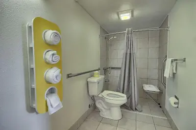 a bathroom with a toilet and a shower at Motel 6-Lima, OH in Lima