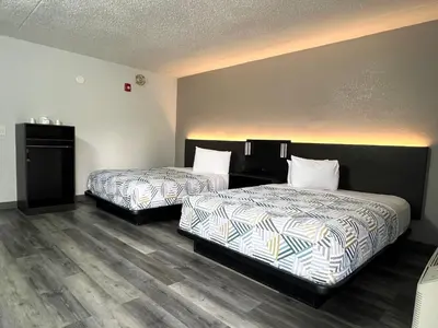 two beds in a hotel room with at Motel 6-Middleburg Heights, OH - Cleveland in Middleburg Heights
