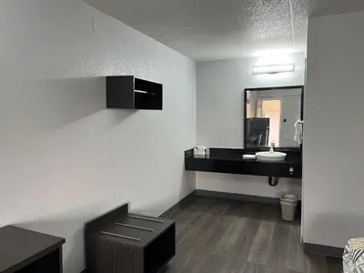 a bathroom with a sink and a mirror at Motel 6-Middleburg Heights, OH - Cleveland in Middleburg Heights